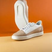 Product pair of orange and white shoes one