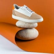 Product pair of orange and white shoes three